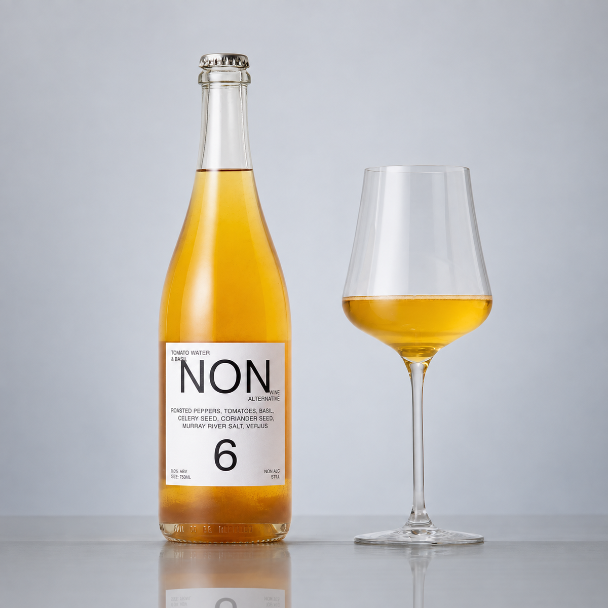 NON6 Tomato Water and Basil bottle and filled wine glass on a grey background